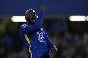 Chelsea's Romelu Lukaku celebrates after scoring his side's opening goal during the English Premier League soccer match between Chelsea and Brighton at Stamford Bridge Stadium in London, England, Wednesday, Dec. 29, 2021