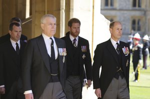 From right, Prince Edward, Prince Harry, Prince Andrew and Peter Phillips walk in a procession during the funeral of Britain's Prince Philip inside Windsor Castle in Windsor, England, Saturday, April 17, 2021