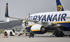 A Ryanair jetplane parks at the airport in Weeze, Germany, Wednesday, Sept. 12, 2018