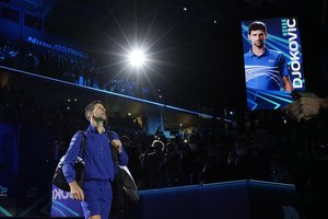 Serbia's Novak Djokovic enters the field of play prior to play against Norways' Casper Ruud during their ATP World Tour Finals singles tennis match, at the Pala Alpitour in Turin, Nov. 15, 2021