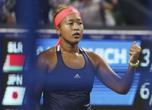 Naomi Osaka, of Japan, celebrates after defeating Aliaksandra Sasnovich, of Belarus, during the women's singles quarterfinal match at the Pan Pacific Open women's tennis tournament in Tokyo, Friday, Sept. 23, 2016