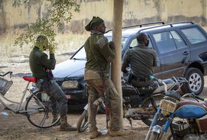 Security forces guard the Government Girls Junior Secondary School where more than 300 girls were abducted by gunmen on Friday, in Jangebe town, Zamfara state, northern Nigeria Sunday, Feb. 28, 2021