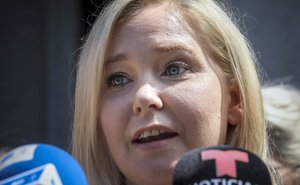 FILE - Virginia Roberts Giuffre speaks during a press conference outside a Manhattan court in New York, Aug. 27, 2019