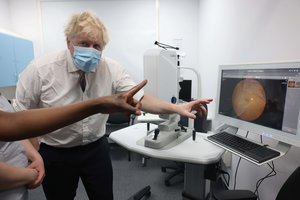 Britain's Prime Minister Boris Johnson, gestures during a visit to Finchley Memorial Hospital, in North London, Tuesday, Jan. 18, 2022.