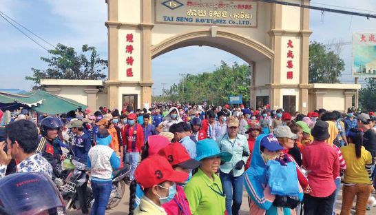 Garment workers pour out of the Tai Seng Bavet SEZ earlier this week in Svay Rieng province during a large protest, calling for a higher minimum wage for the industry.