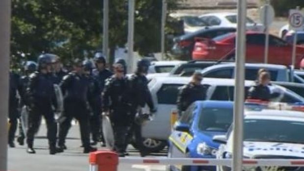 Riot police prepare to enter Malmsbury Youth Justice Centre.