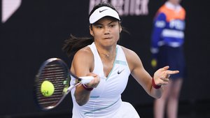 Emma Raducanu of Britain plays a forehand return to Danka Kovinic of Montenegro during their second round match at the Australian Open tennis championships in Melbourne, Australia, Thursday, Jan. 20, 2022