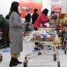 Shoppers lining up at Broadway Coles last month.