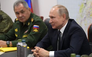 File - Vladimir Putin During a meeting with President of the Syrian Arab Republic Bashar al-Assad. With Defense Minister Sergei Shoigu, 7 January 2020