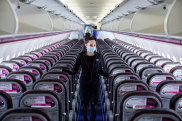 A member of the cabin crew wearing a protective face mask checks cabin seating ahead of the flight on-board a passenger aircraft operated by Wizz Air Holdings Plc at Liszt Ferenc airport in Budapest, Hungary, on Monday, May 25, 2020. Wizz Air is plotting a major expansion at London Gatwick airport as rival carriers pull back, paving the way for the Hungarian low-cost carrier to emerge from the travel downturn with a bigger presence in the world’s busiest city for pass