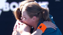 Jelena Dokic and Alize Cornet embrace on the court.