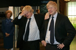 Mayor of London Boris Johnson, left, poses with a wax figure of himself at Madame Tussauds wax museum in London Tuesday, May 5, 2009, after being introduced to his new wax figure