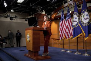 Speaker of the House Nancy Pelosi, D-Calif., speaks to reporters during her weekly press conference at the Capitol in Washington, Thursday, Jan. 13, 2022.