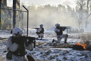 In this photo provided by the Russian Defense Ministry Press Service on Tuesday, Jan. 25, 2022, Russian soldiers attend a military exercising at the Golovenki training ground in the Moscow region, Russia