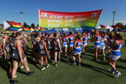 SYDNEY, AUSTRALIA - JANUARY 28: Players run through a joint banner during the 2022 AFLW Round 04 match between the GWS Giants and the Western Bulldogs at Henson Park on January 28, 2022 in Sydney, Australia. (Photo by Dylan Burns/AFL Photos via Getty Images)