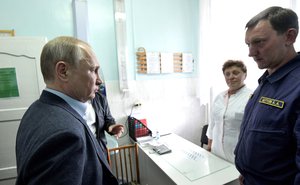 File - During the inspection of the temporary accommodation center for citizens affected by the flood, Vladimir Putin got acquainted with the work of the medical office. Irkutsk region, Tulun.