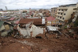 A destroyed house is covered by mud from a landslide caused by tropical storm Ana in Antananarivo, Madagascar, Wednesday, Jan. 26, 2022