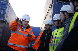 British Prime Minister Boris Johnson speaks with port workers as he visits Tilbury Docks in Tilbury, England, Monday, Jan. 31, 2022.