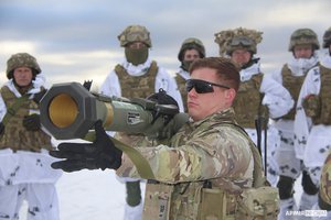 In this photo provided by the Ukrainian Defense Press Service taken on Jan. 30, 2022, an US instructor trains Ukrainian soldiers for the use of M141 Bunker Defeat Munition (SMAW-D) missiles at the Yavoriv military training ground, close to Lviv, western Ukraine, Sunday, Jan. 30, 2022.