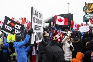 Protestors show their support for the Freedom Convoy of truck drivers who are making their way to Ottawa to protest against COVID-19 vaccine mandates by the Canadian government on Thursday, Jan. 27, 2022, in Vaughan