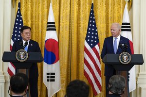 FILE - In this May 21, 2021, file photo, U.S. President Joe Biden listens as South Korean President Moon Jae-in speaks during a joint news conference in the East Room of the White House in Washington.