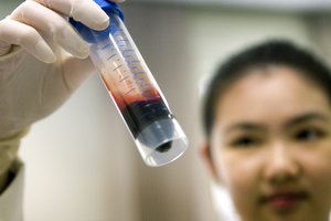 A lab officer prepares blood samples from a cancer patient for further DNA testing, Thursday April 19, 2007 at a medical lab at the National University Hospital in Singapore, a country well known for its advanced medical treatment and research facilities.