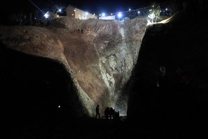 Civil defense workers and local authorities attempt to rescue a 5-year-old boy who fell into a hole in the northern village of Ighran in Morocco's Chefchaouen province, Friday, Feb. 4, 2022 in Ighran