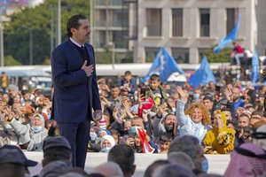 Former Lebanese Prime Minister Saad Hariri waves to his supporters after he paid his respect at the grave of his father, former Prime Minister Rafik Hariri, on the seventieth anniversary of his assassination in Beirut, Lebanon, Monday, Feb. 14, 2022.