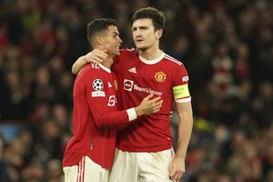 Manchester United's Cristiano Ronaldo, left, and Manchester United's Harry Maguire celebrate after the the Champions League Group F soccer match between Manchester United and Atalanta at Old Trafford, Manchester, England, Wednesday, Oct. 20, 2021.