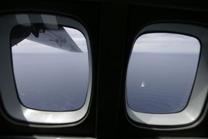 A fishing boat sails as a Frontex flight patrol operates over the Ionian Sea, southwestern Greece on Wednesday, May 27, 2015.