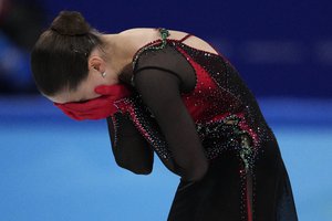 Kamila Valieva, of the Russian Olympic Committee, reacts after the women's free skate program during the figure skating competition at the 2022 Winter Olympics, Thursday, Feb. 17, 2022, in Beijing.