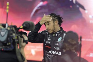 Mercedes driver Lewis Hamilton of Britain reacts after finishing second in the Formula One Abu Dhabi Grand Prix in Abu Dhabi, United Arab Emirates, Sunday, Dec. 12. 2021