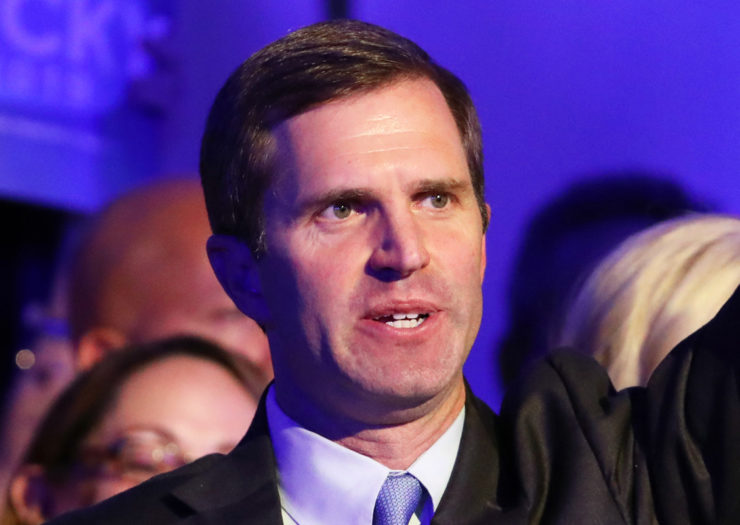 [Photo: Kentucky Governor Andy Beshear speaks during an event.]