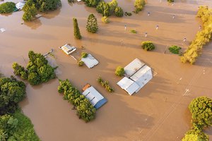 In this photo provided by the Fraser Coast Regional Council, water floods streets and houses in Maryborough, Australia, Monday, Feb. 28, 2022. Heavy rain is bringing record flooding to some east coast areas while the flooding in Brisbane, a population of 2.6 million, and its surrounds is the worst since 2011 when the city was inundated by what was described as a once-in-a-century event.