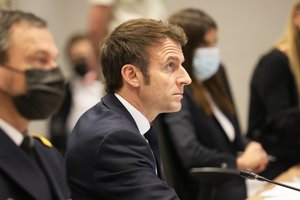 French President Emmanuel Macron attends a video-conference with NATO members at the French Army headquarters, Friday, Feb. 25, 2022 in Paris.