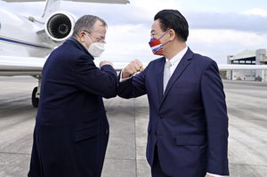 In this photo released by Taiwan’s Ministry of Foreign Affairs, Taiwan’s Foreign Minister Joseph Wu, right, greets Former Chairman of the Joint Chiefs Adm. Mike Mullen as he arrives at Taipei Songshan Airport in Taipei, Taiwan, Tuesday, March 1, 2022.