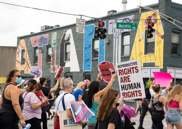 Photo of demonstrators rallying in support of women's reproductive rights in Atlanta