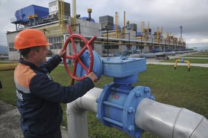 FILE - A worker at a Ukrainian gas station Volovets in western Ukraine on Oct. 7, 2015.