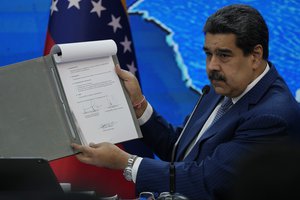 Venezuelan President Nicolas Maduro gives a press conference from Miraflores presidential palace in Caracas, Venezuela, Monday, Aug. 16, 2021