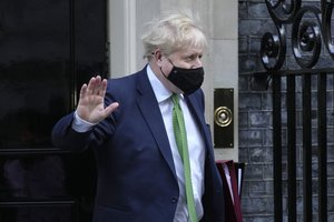 Britain's Prime Minister Boris Johnson leaves 10 Downing Street to attend the weekly session of Prime Ministers Questions in Parliament in London, Wednesday, Jan. 19, 2022.