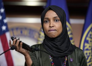 Rep. Ilhan Omar, D-Minn., plays a recording of a death threat left on her voicemail in the wake of anti-Islamic comments made last week by Rep. Lauren Boebert, R-Colo., who likened Omar to a bomb-carrying terrorist, during a news conference at the Capitol in Washington, Tuesday, Nov. 30, 2021.