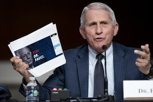 Dr. Anthony Fauci, director of the National Institute of Allergy and Infectious Diseases and chief medical adviser to the president, testifies before a Senate Health, Education, Labor, and Pensions Committee hearing to examine the federal response to COVID-19 and new emerging variants, Tuesday, Jan. 11, 2022 on Capitol Hill in Washington