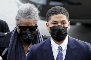 Actor Jussie Smollett arrives with his mother Monday, Nov. 29, 2021, at the Leighton Criminal Courthouse for jury selection at his trial in Chicago