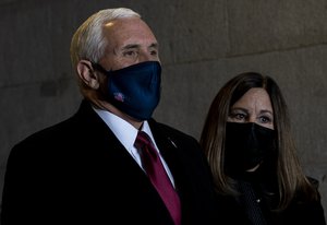 Mike Pence and his wife wait to walk onto the inaugural platform during the 59th Presidential Inauguration at the U.S. Capitol Building, Washington, D.C., Jan. 20, 2021