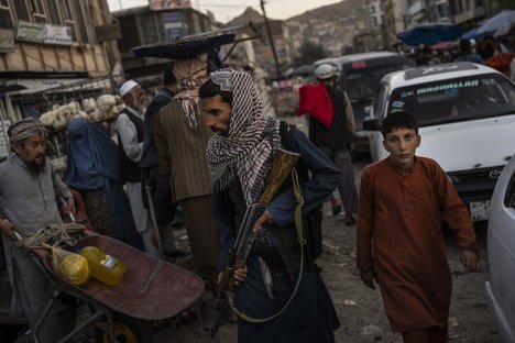 Taliban fighters patrol a market in Kabul's Old City, Afghanistan, Tuesday, Sept. 14, 2021.