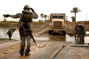 US Army Soldiers shuttle trucks in support a combat operation near Baghdad, Iraq