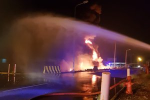 In this photo provided by the Saudi Press Agency, firefighters try to extinguish a blaze at an Aramco terminal in the southern border town of Jizan, Saudi Arabia, early Sunday, March 20, 2022