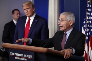 President Donald Trump listens as Dr. Anthony Fauci in the James Brady Press Briefing Room of the White House in Washington