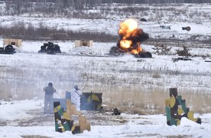 Ukrainian soldiers train for the use of US M141 Bunker Defeat Munition (SMAW-D) missiles at the Yavoriv military training ground, close to Lviv, western Ukraine, Friday, Feb. 4, 2022. The U.S. accused the Kremlin on Thursday of an elaborate plot to fabricate an attack by Ukrainian forces that Russia could use as a pretext to take military action against its neighbor.