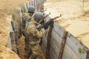 YAVORIV, Ukraine-- Ukrainian Soldiers assigned to 1st Battalion, 80th Airmobile Brigade clear a trench during a live-fire training exercise, Nov. 12, at the International Peacekeeping and Security Center